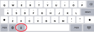 iPad keyboard with microphone icon circled in red