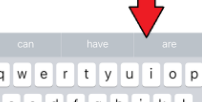 word prediction words above iOS keybaord with arrow pointing to words 