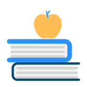 two books stacked with apple on top