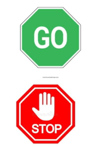 2 signs one red Stop sign one green Go sign
